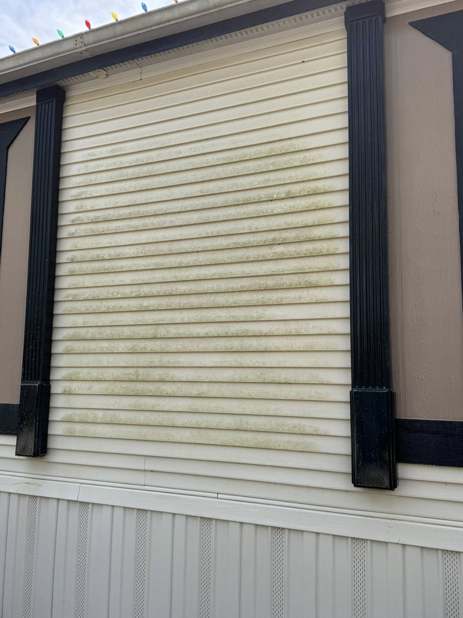 Dirty side of house before cleaning
